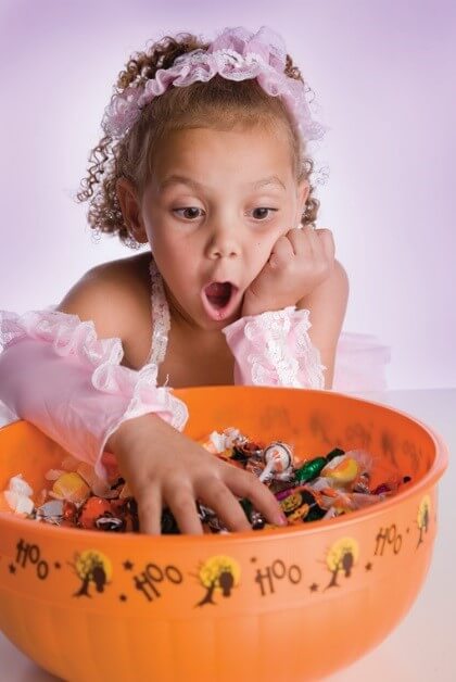 child reaching for candy